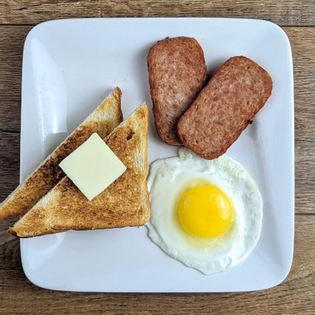 Choice of Meat, 1 Egg, Breakfast Potatoes & Toast.